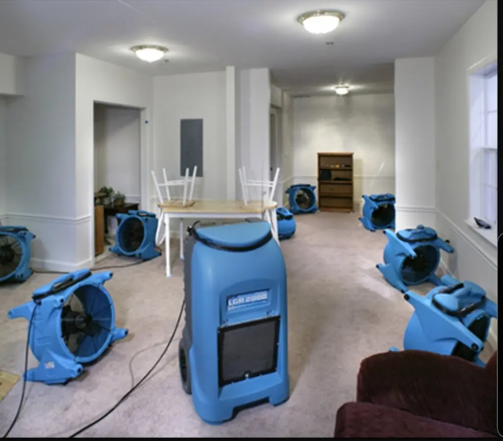 Air movers and dehumidifier setup for Water Damage Restoration in Charles City