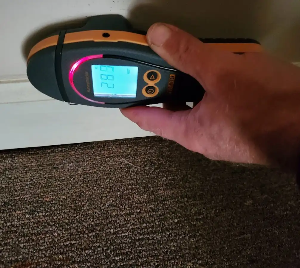 Moisture detection at baseboard during Burst Pipe Cleanup in Charles City